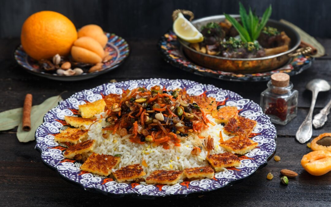 Iranian wedding pilaf topped with nuts, orange zest and raisins, rustic style